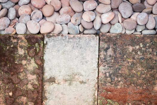 Pebble stones and bricks abstract background, stock photo