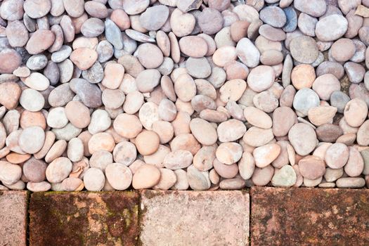 Pebble stones and bricks abstract background, stock photo