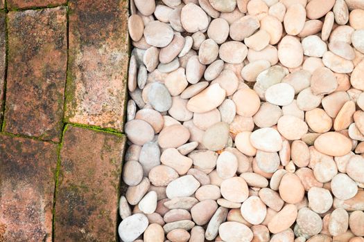 Pebble stones and bricks abstract background, stock photo