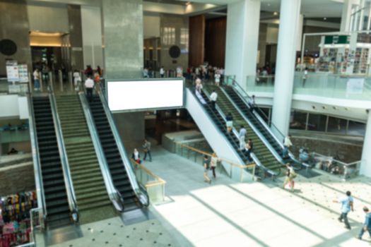 Crowd walking with escalator working at office