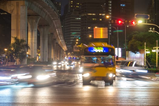 traffic light trails in modern city at night Thailand