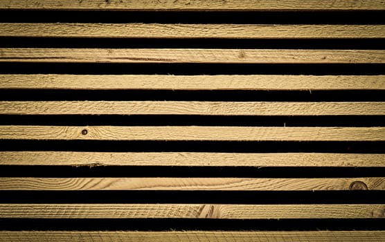 Unique background with stacked wooden planks, wonderful details with wood knots and strong lines.