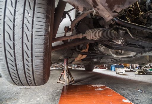 Repair of old car in the garage.