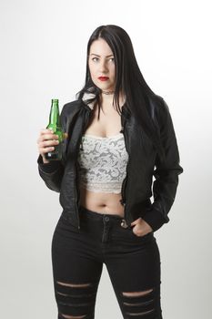 twenty something girl holding a green bottle of beer