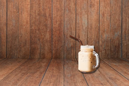 Iced coffee on old wooden interior texture background, stock photo