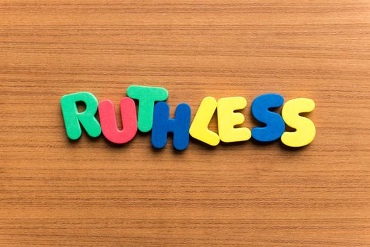 ruthless colorful word on the wooden background