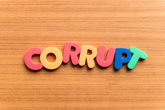 corrupt colorful word on the wooden background