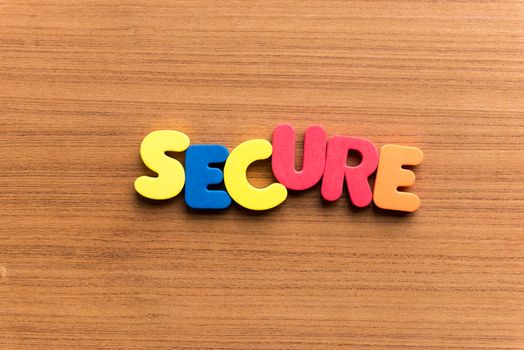 secure colorful word on the wooden background
