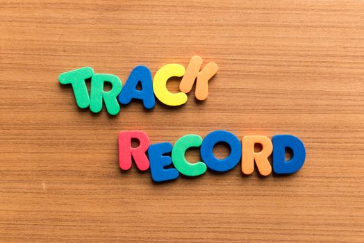 track record colorful word on the wooden background