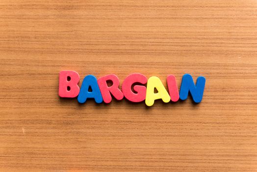 bargain colorful word on the wooden background