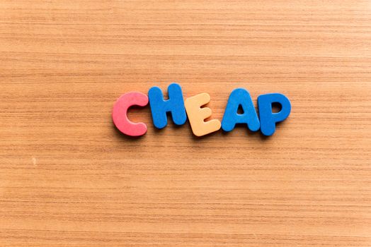 cheap colorful word on the wooden background