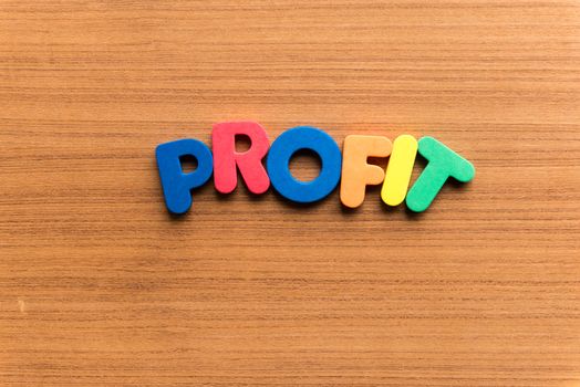 profit colorful word on the wooden background