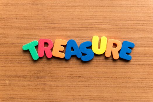treasure colorful word on the wooden background