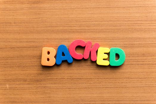 backed colorful word on the wooden background