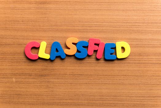 classified colorful word on the wooden background