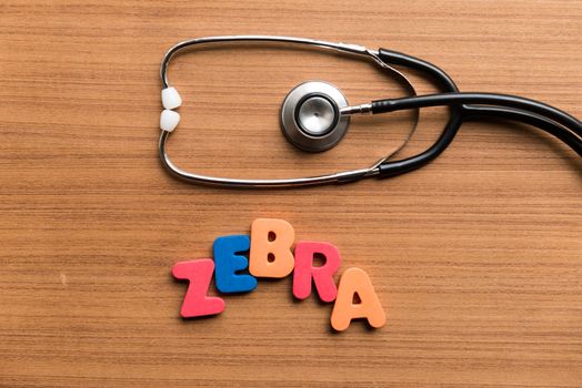 zebra colorful word with stethoscope on wooden background