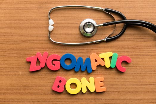zygomatic bone colorful word with stethoscope on wooden background