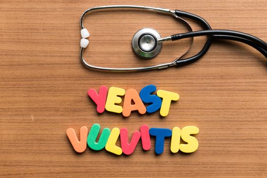 yeast vulvitis colorful word with stethoscope on wooden background