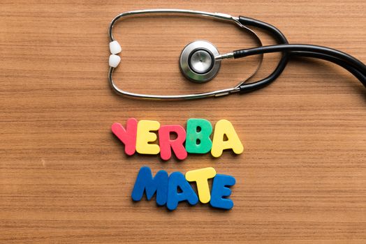 yerba mate colorful word with stethoscope on wooden background