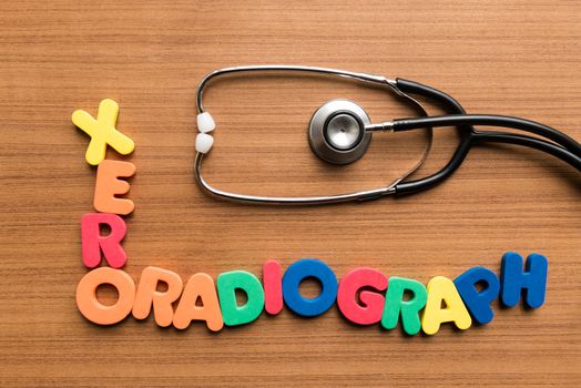 xeroradiograph colorful word with stethoscope on wooden background