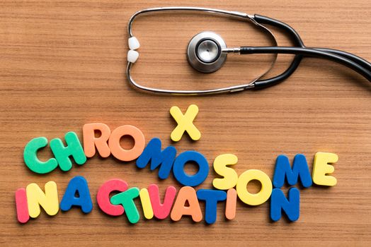 X chromosome inactivation colorful word with stethoscope on wooden background