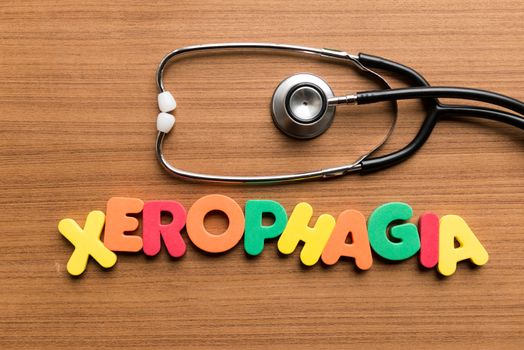 xerophagia colorful word with stethoscope on wooden background