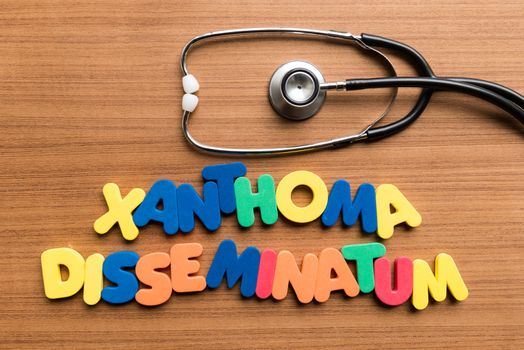 xanthoma disseminatum colorful word with stethoscope on wooden background