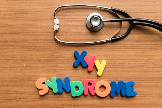 xyy syndrome colorful word with stethoscope on wooden background