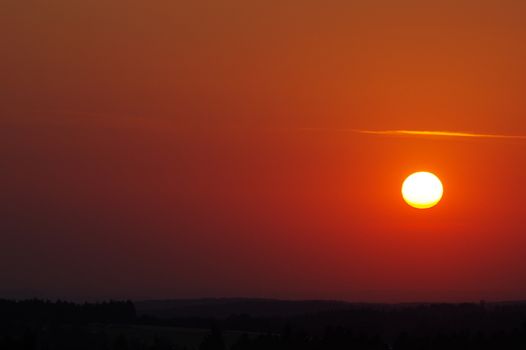 red Sunset over the treetop of trees in the Black Forest in Germany