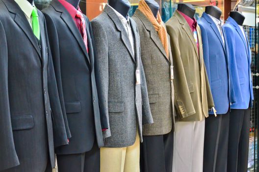 Range of suits on Shop Mannequins at front of shop