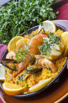 traditional spanish cuisine paella with shrimps and vegetables