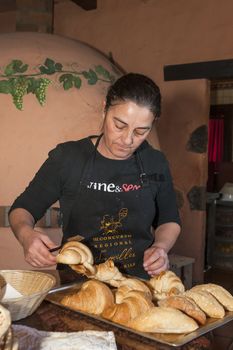 Tenerife, Spain, January 2015: Waitress prepare fresh pan for customers on Bodega Monje- one of leading wine manufactures on north of Tenerife