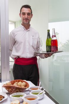 Tenerife, Spain, May 2015: waiter with tray of drinks champagne