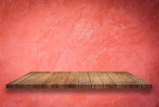 Empty perspective top wooden shelf on red wall background