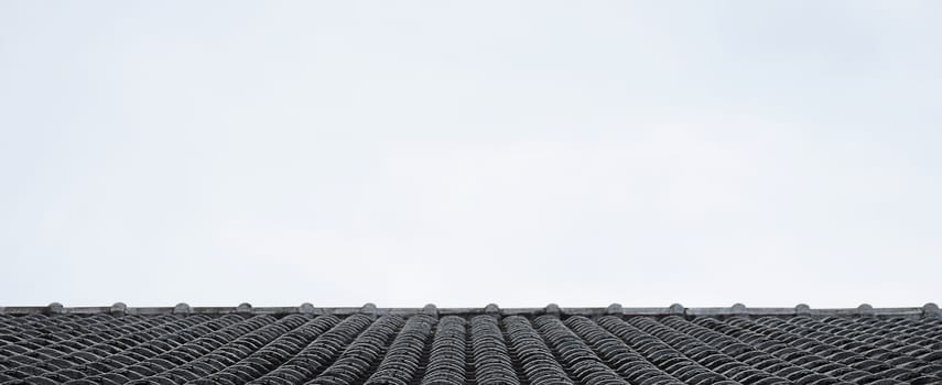Close up roof texture with blue sky background.