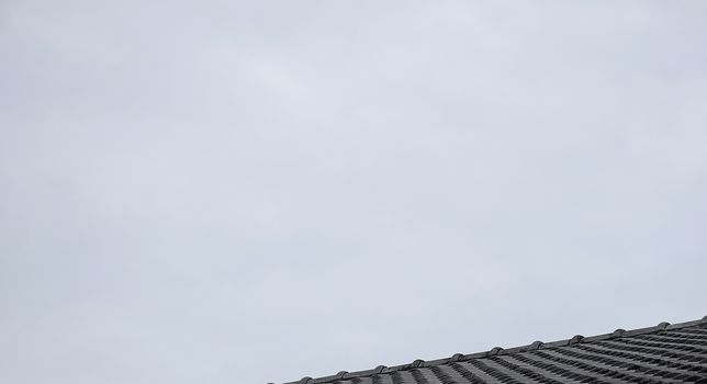 Close up roof texture with blue sky background.