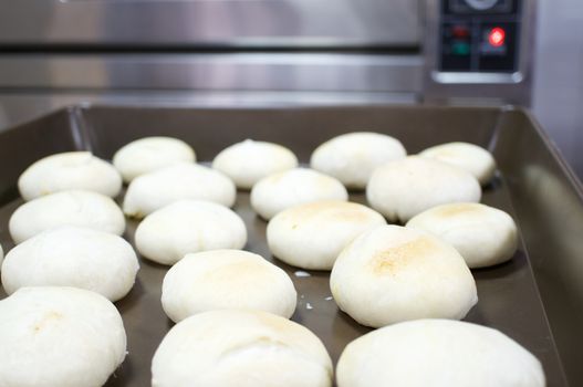 Chinese Pastry Mung Bean on brown oven tray have oven as background.