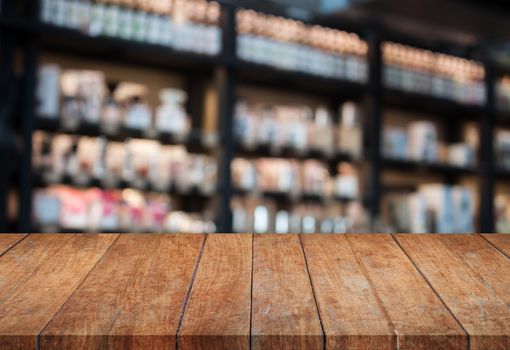 Perspective top wooden table with blurred cafe background. product display template