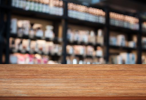 Top wooden table in coffee shop blurred background with bokeh