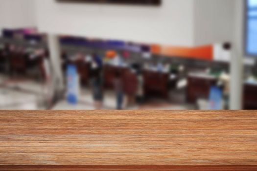 Top of wooden table on blurred background of Airport, stock photo