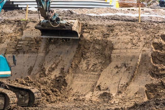 Construction site with excavator during excavation