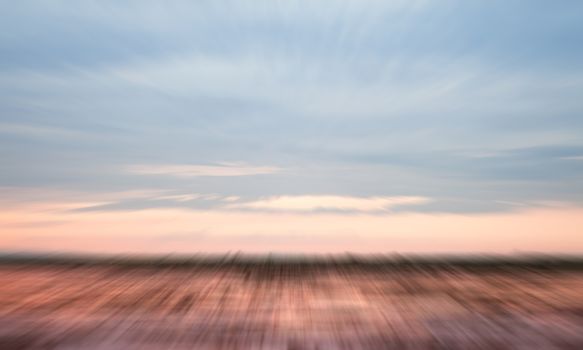 Sunrise on the lake with beautiful sky with motion blur background