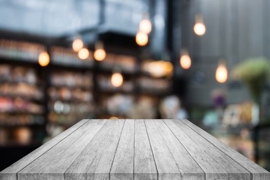 Black and white table top wood with coffee shop blurred background with bokeh