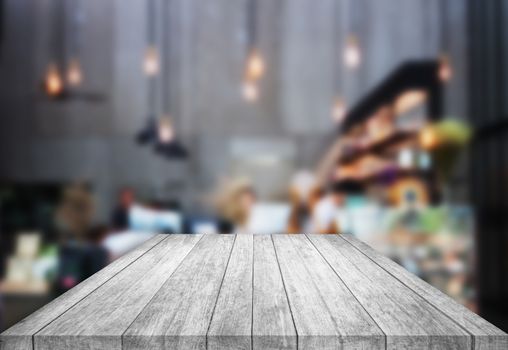 Black and white table top wooden with blurred background in coffee shop, stock photo