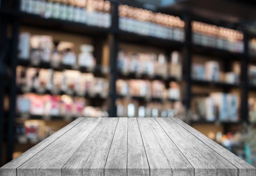 Black and white tabletop wooden with blurred cafe background. product display template