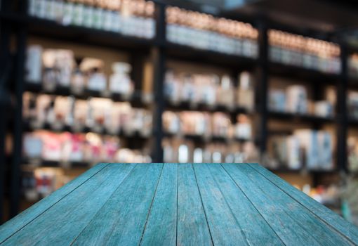 Perspective blue wooden with coffee shop blurred background with bokeh, stock photo