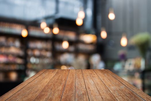 Perspective wooden on coffee shop blurred background with bokeh, stock photo