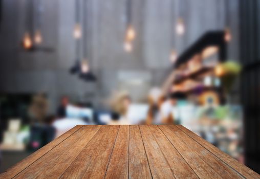 Perspective wooden with blurred background in coffee shop, stock photo