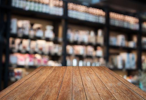 Perspective wooden with coffee shop blurred background with bokeh, stock photo