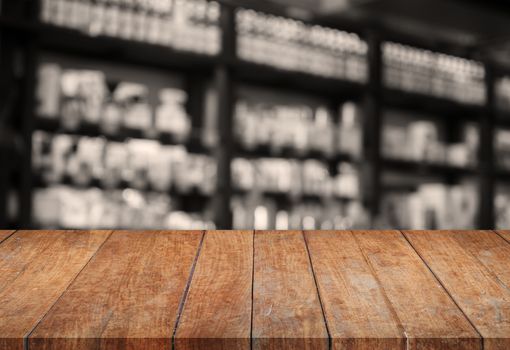 Wooden tabletop with sepia blurred background, stock photo